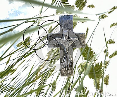 Christian religious symbols are the cross, the triune God, & the dove or spirit. Looking up from the field of ryegrass we see the Stock Photo