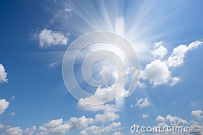 Christian shining cross in blue cloudy sky Stock Photo