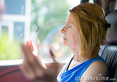 Christian Woman Praying with Arms Raised Stock Photo