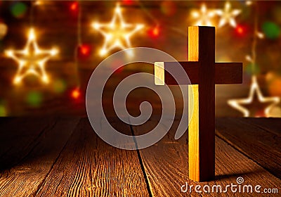 Christian wood cross on Christmas stars Stock Photo