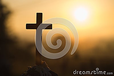 Christian wooden cross on a background with dramatic lighting, Jesus Christ cross, Easter, resurrection concept. Christianity, Stock Photo