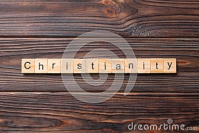 Christianity word written on wood block. christianity text on table, concept Stock Photo