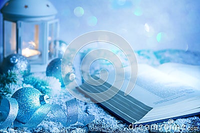 Christmas abstract decoration ornament background with bible baubles and lantern on empty table in blue Stock Photo