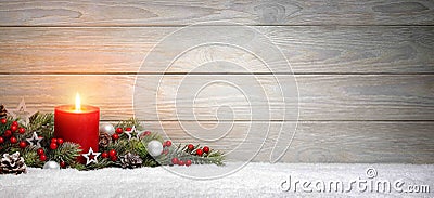 Christmas or Advent wood background with a candle Stock Photo