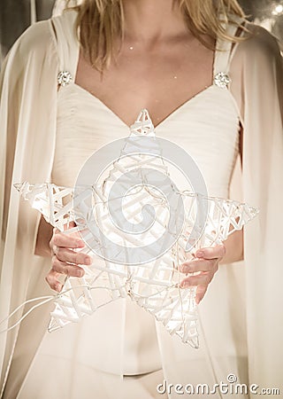 Christmas angel holding a star Stock Photo