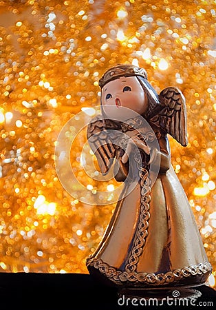 Christmas angel music box with gold background Stock Photo