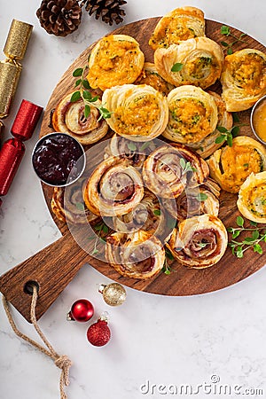 Christmas appetizers, puff pastry wheels filled with cheese and jam Stock Photo