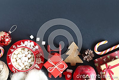 Christmas apportion top view. Cocoa with marshmallows, a gift, lollipop, pomegranate, books Stock Photo