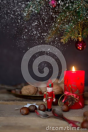 Christmas arrangement with a candle, fir branches and Christmas decorations Stock Photo