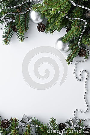 Christmas arrangement with silver decorations such as baubles, chain and bells. White background with nature elements like Stock Photo