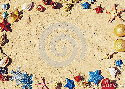 Christmas background on the beach with shells on the sand Stock Photo