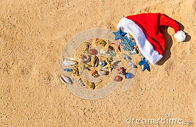 Christmas background on the beach with shells on the sand Stock Photo