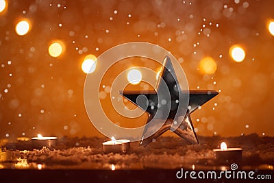 Christmas background with big silver star, candles, snow, bokeh lights, snowing, x-mas Stock Photo