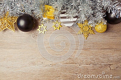 Christmas background with black, golden and silver decorations on wooden table. View from above with copy space Stock Photo