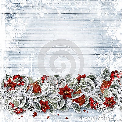 Christmas background with a border fir branches, red berries and balls on wooden boards Stock Photo