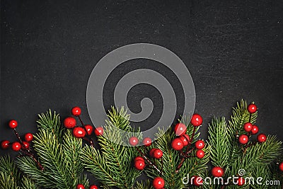 Christmas background border with christmas pine tree decor on vintage dark table. Top view. Winter holiday greeting card design. Stock Photo