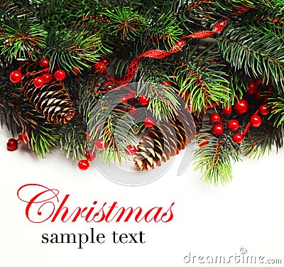 Christmas background. Christmas boarder with fir tree branch with cones and ornament. Christmas baubles in golden and red colour. Stock Photo