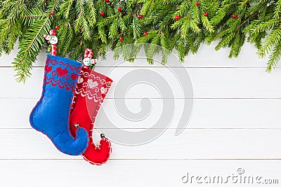 Christmas background. Christmas fir tree with decoration, red and blue Christmas socks on white wooden background, copy Stock Photo