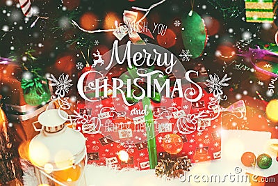 Christmas background with Christmas decoration with snow, stars, gifts, sparking and text Merry Christmas and Happy New Year Stock Photo
