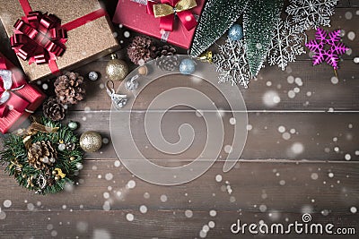 Christmas background with decorations and gift boxes on wood background, snowflakes. Xmas and Happy New Year Stock Photo