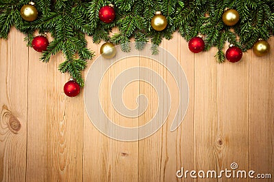 Christmas background with firtree and baubles on wood Stock Photo