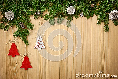 Christmas background with firtree, decorative trees and cones on Stock Photo