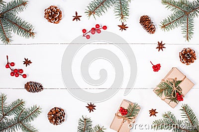 Christmas background with Christmas gift, fir branches, pine cones, snowflakes, red decorations. Xmas and Happy New Year compositi Stock Photo