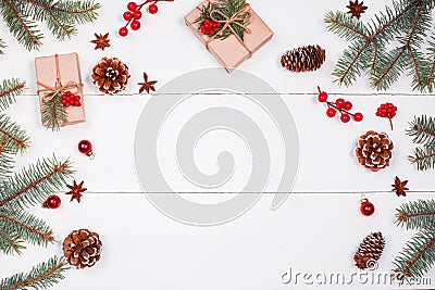 Christmas background with Christmas gift, fir branches, pine cones, snowflakes, red decorations. Xmas and Happy New Year Stock Photo