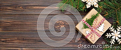 Christmas Background Christmas gift with fir branches and snowflake on wooden white background with banner copy space Flat lay, Stock Photo