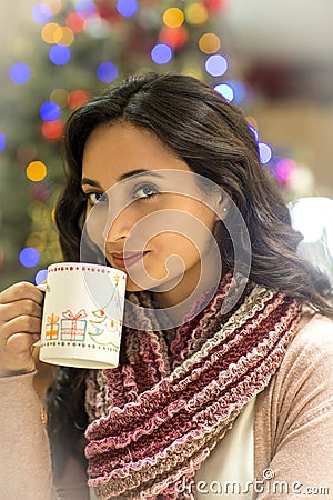 Christmas background with girl taking punch Stock Photo