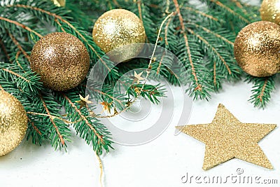 Christmas background . Green Branches if frame a white background. It is decorated by New Year`s g Stock Photo