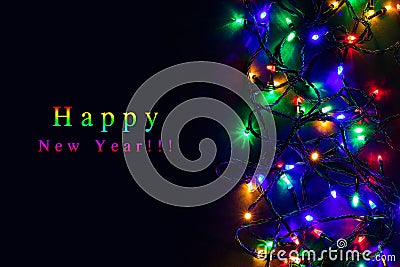 Christmas background with lights and free text space. Christmas lights border. Glowing colorful Christmas lights on black Stock Photo