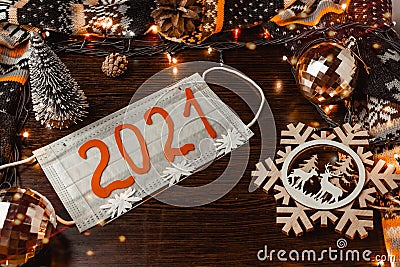 Medi mask with numbers 2021, decorations snowflake deer Christmas decorations, dark background, lights, Christmas background. Stock Photo