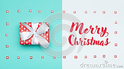 Christmas background. Pastel blue festive winter holidays backdrop. Beautifully wrapped christmas present. Xmas card. Stock Photo