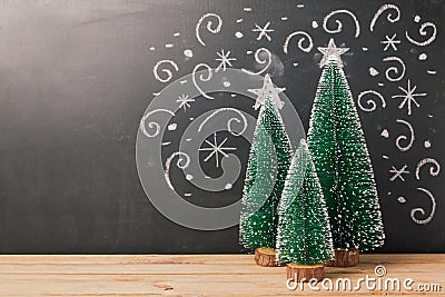 Christmas background with pine tree over chalkboard drawing Stock Photo