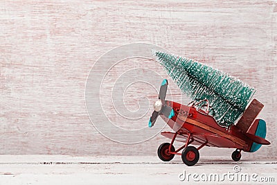 Christmas background with rustic vintage airplane toy and pine tree Stock Photo