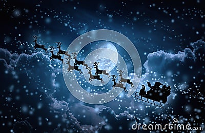 Christmas background. Silhouette of Santa Claus flying on a sleigh pulled by reindeer. Stock Photo