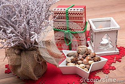 Christmas background with snow covered tree, candle holder, xmas present Stock Photo