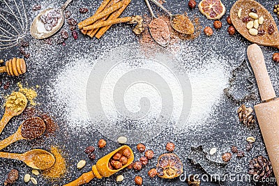 Christmas Background with Spices, Nuts, Rosines, Ginger, Cocoa Powder, Dried Oranges Stock Photo