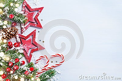 Christmas background with stars, snowy fir branches, cones and bokeh lights. Holiday banner or card Stock Photo