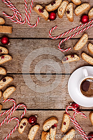 Christmas Background Vertical Wooden Background with Cup of Coffee Candy Cane and Cookies Top View Flat Lay Stock Photo