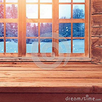 Christmas background with wooden empty table over window and winter nature landscape. Winter holiday house interior Stock Photo