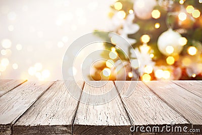 Christmas background. Wooden planks over blurred holiday tree lights Stock Photo