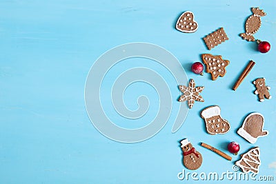 Christmas baking background. Christmas gingerbread cookies and spices on blue table. Top view Stock Photo