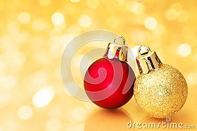 Christmas balls on gold sparkle background. Stock Photo