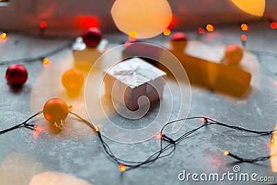 Christmas balls and white vinous gift boxes form the decoration of the Christmas tree, in the background in the form of a bokeh Stock Photo