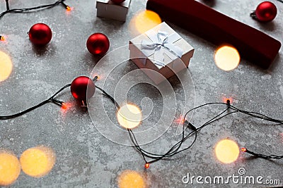 Christmas balls and white vinous gift boxes form the decoration of the Christmas tree, in the background in the form of Stock Photo