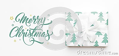Christmas banner. Beautiful christmas gift isolated on white background. Turquoise colored wrapped xmas box. Gift wrapping. Stock Photo