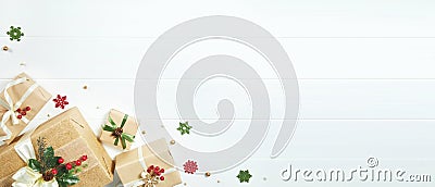 Christmas banner with border of gift boxes on white wood background Stock Photo