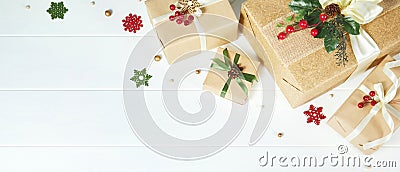 Christmas banner with border of gift boxes on white wood background Stock Photo